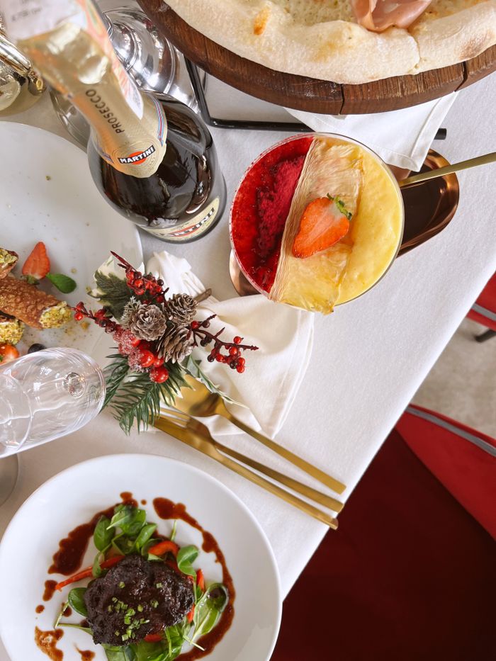 services-02 An elegant dining setup with festive decor and gourmet dishes, perfect for celebrations.