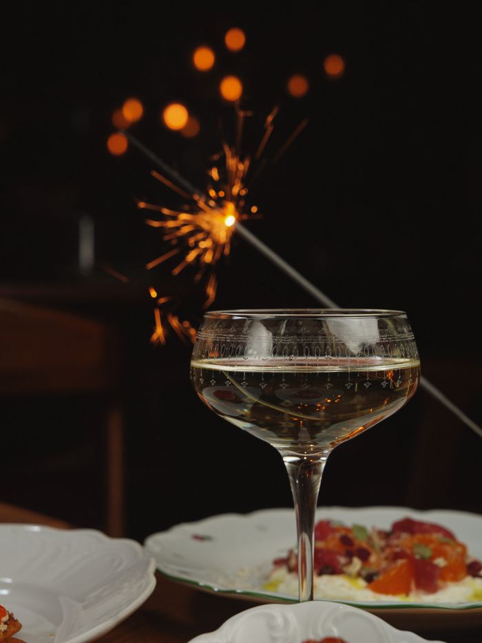 gallery-01 Champagne glass with a sparkler adds a festive touch to the celebration ambiance.